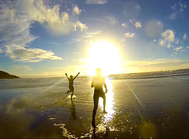Young people running into the sea Young people running into the sea