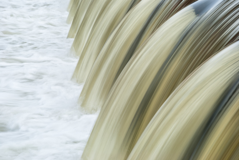Water flowing over a weir Water flowing over a weir