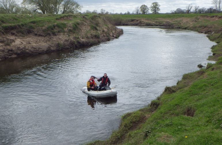 NRW officers investigating the pollution in the River Dee NRW officers investigating the pollution in the River Dee