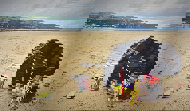 A black bag of fireworks on a beach A black bag of fireworks on a beach