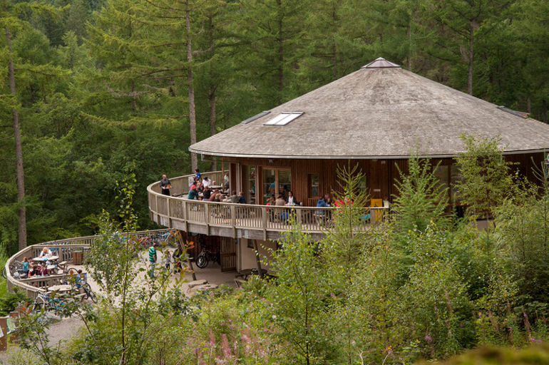 Coed y Brenin visitor centre surrounded by trees Coed y Brenin visitor centre surrounded by trees
