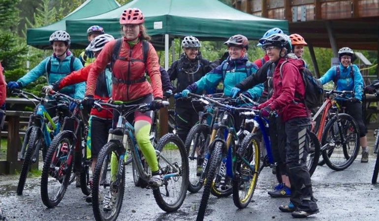 A group of women with mountain bikes A group of women with mountain bikes