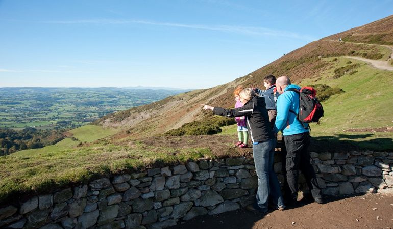 Family looking out from a hillside