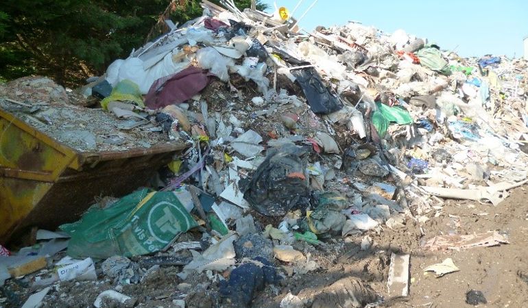 A skip and rubbish A skip and rubbish