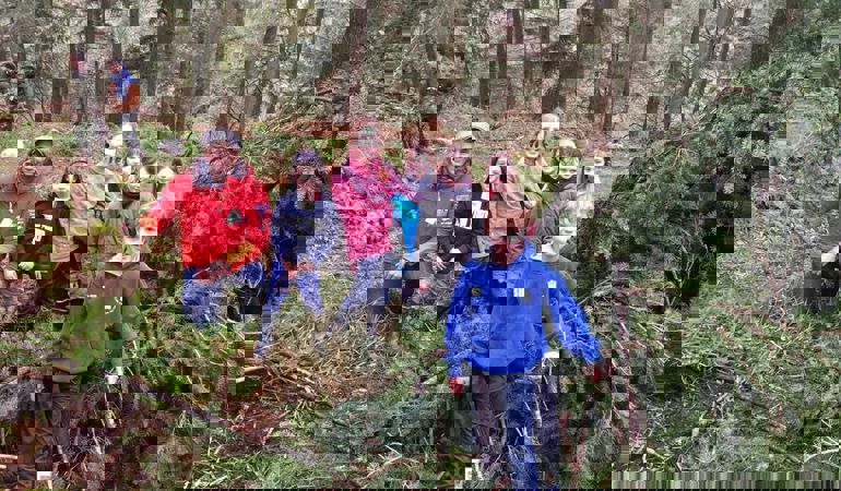 Photo of children in a woodland learning about the outdoors with Welsh adventurer Richard Parks Photo of children in a woodland learning about the outdoors with Welsh adventurer Richard Parks