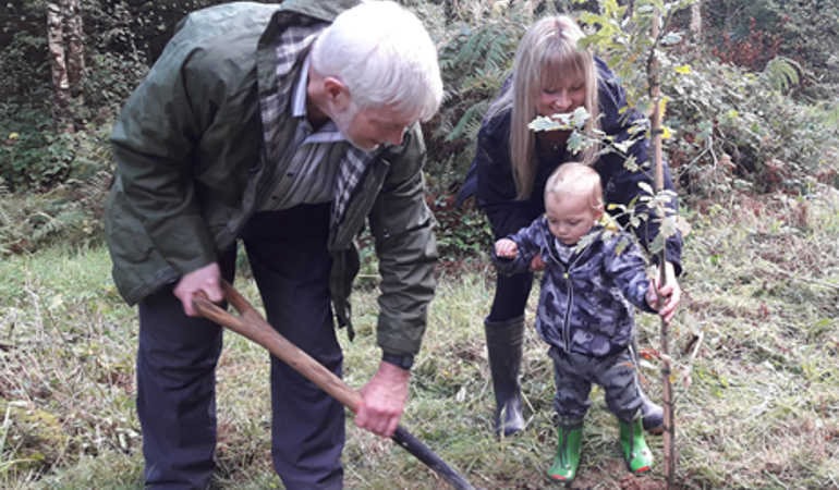 Terry Davis and Caroline riches planting an oak tree Terry Davis and Caroline riches planting an oak tree