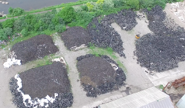 An aerial image of piles of waste tyres An aerial image of piles of waste tyres