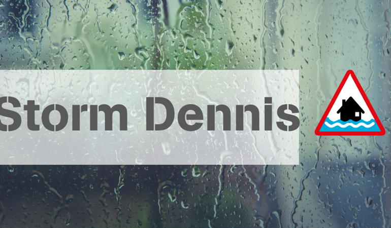 Image of rain on a window with the text Sotrm Dennis Image of rain on a window with the text Sotrm Dennis